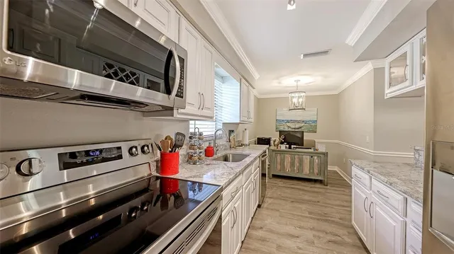 a kitchen with a stove and a refrigerator