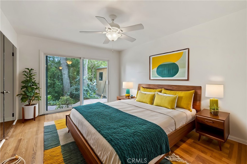 4254 Miramonte Place Riverside, CA 92501 - Photo 17 of 43 a bedroom with a bed and a view of balcony