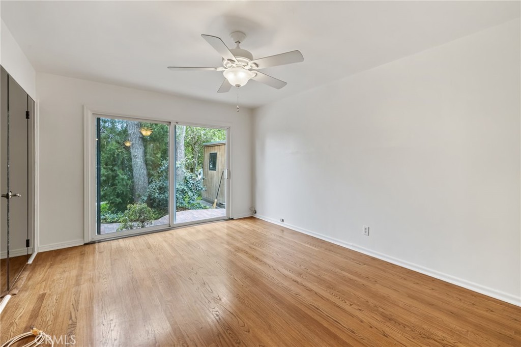 4254 Miramonte Place Riverside, CA 92501 - Photo 18 of 43 a view of a big room with wooden floor and windows