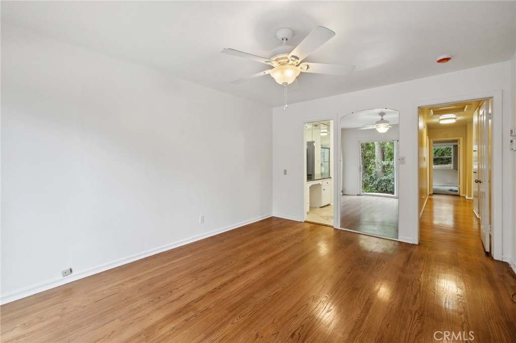 4254 Miramonte Place Riverside, CA 92501 - Photo 19 of 43 a view of an empty room with wooden floor