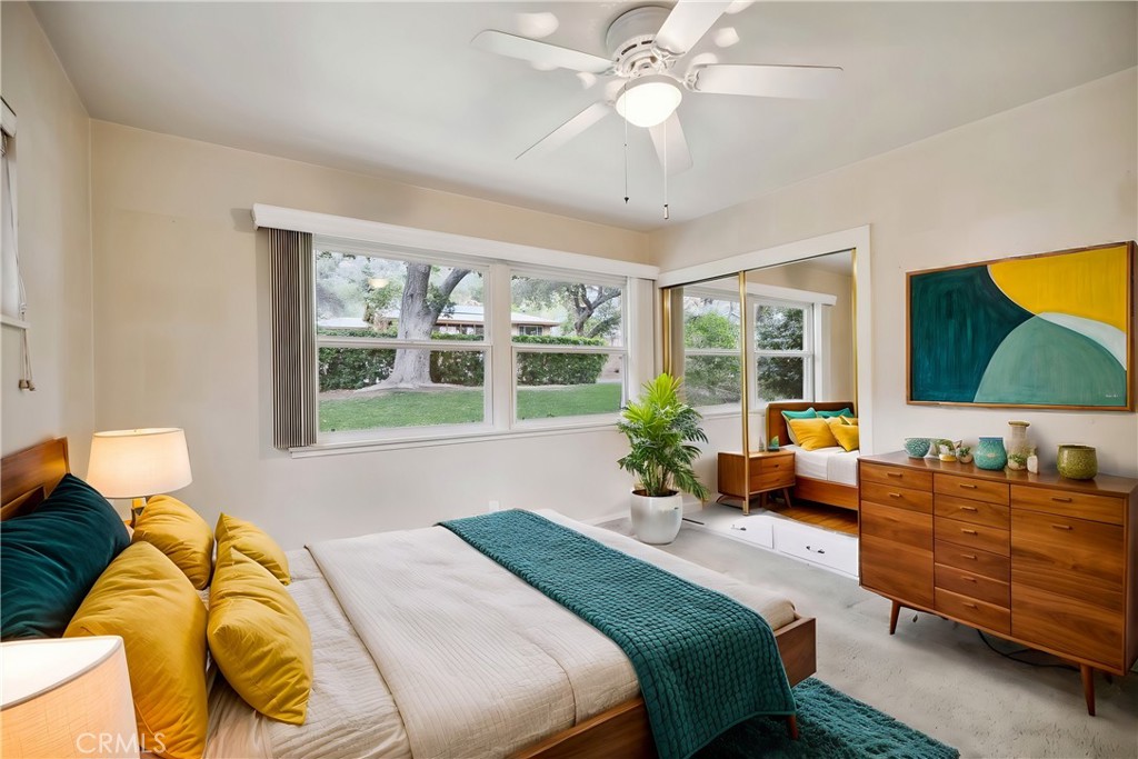 4254 Miramonte Place Riverside, CA 92501 - Photo 25 of 43 a bedroom with a bed and large windows
