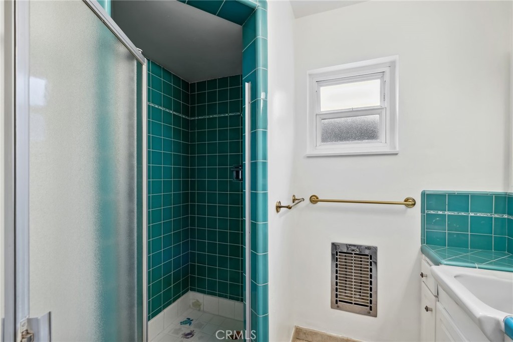 4254 Miramonte Place Riverside, CA 92501 - Photo 31 of 43 a bathroom with a shower and a sink