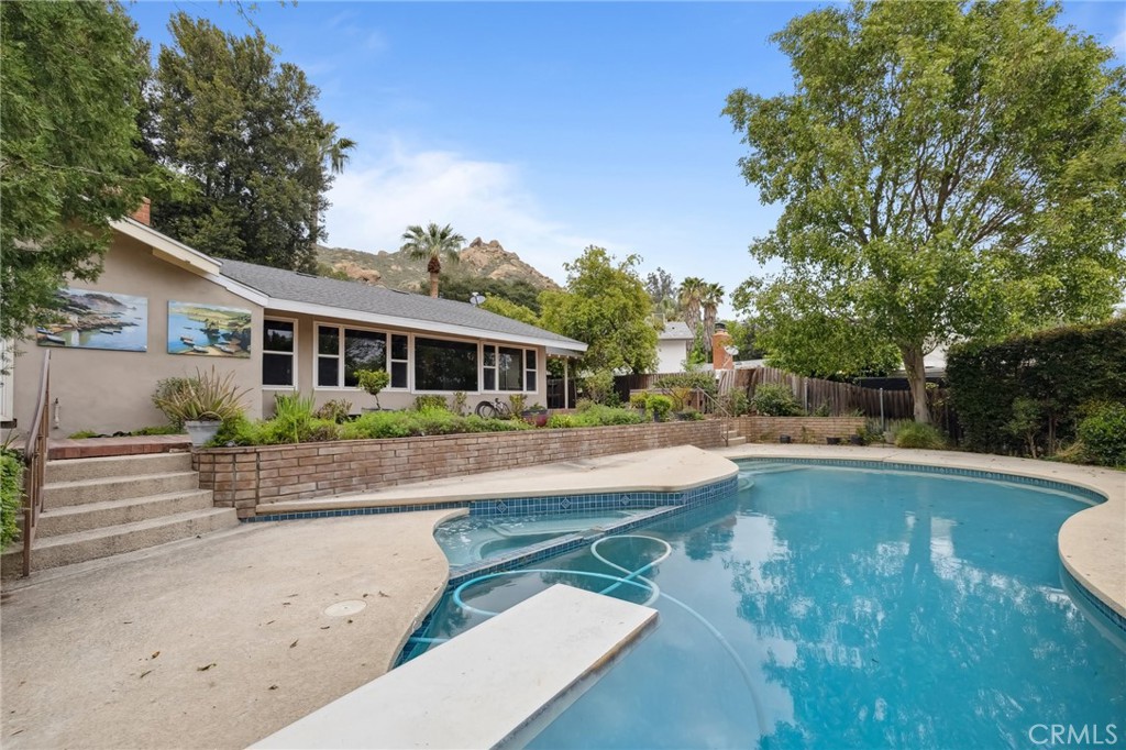 4254 Miramonte Place Riverside, CA 92501 - Photo 36 of 43 a view of house that has a swimming pool with a yard