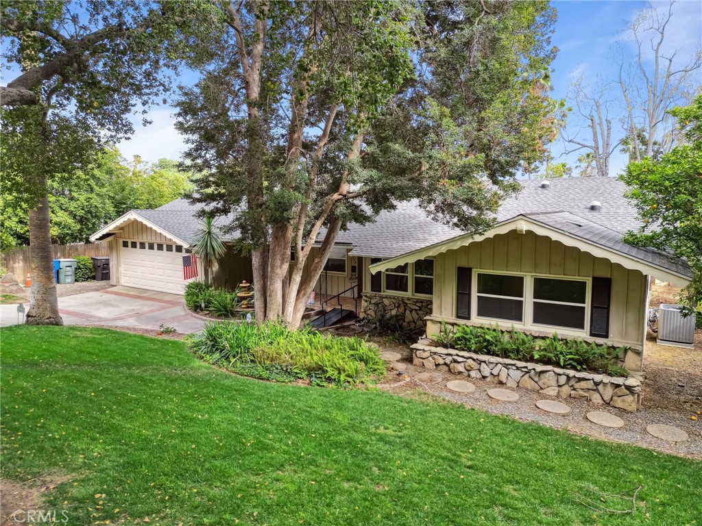 4254 Miramonte Place Riverside, CA 92501 - Photo 4 of 43 a front view of a house with garden