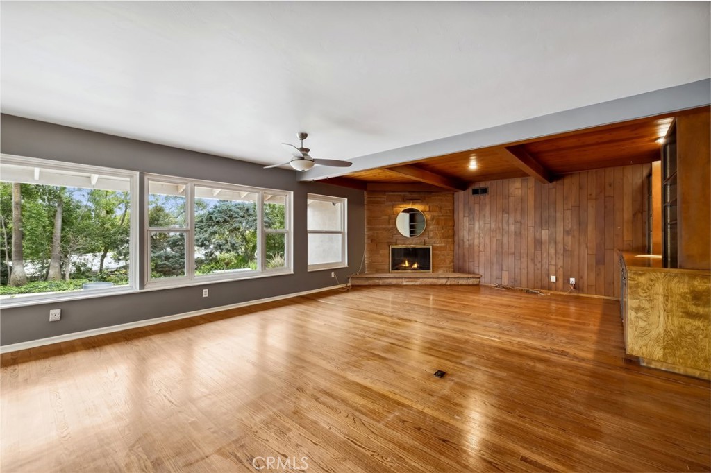 4254 Miramonte Place Riverside, CA 92501 - Photo 7 of 43 a view of empty room with wooden floor and fan