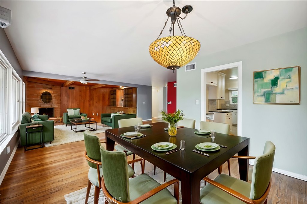 4254 Miramonte Place Riverside, CA 92501 - Photo 8 of 43 a view of a dining room with furniture window and wooden floor