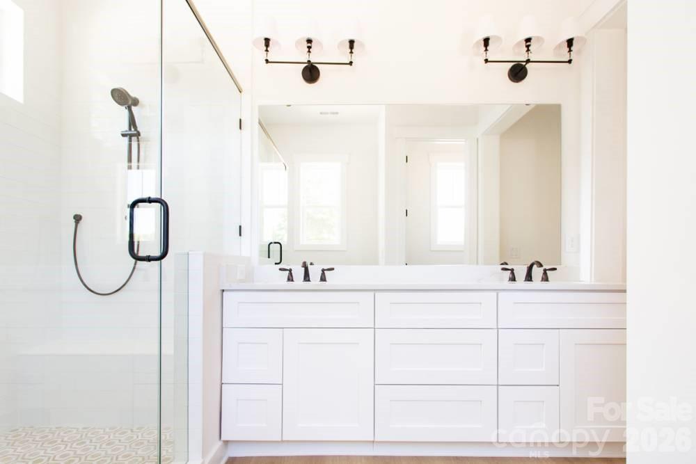 1 Antioch Church Road Weddington, NC 28104 - Photo 12 of 22 a bathroom with a sink vanity and a mirror