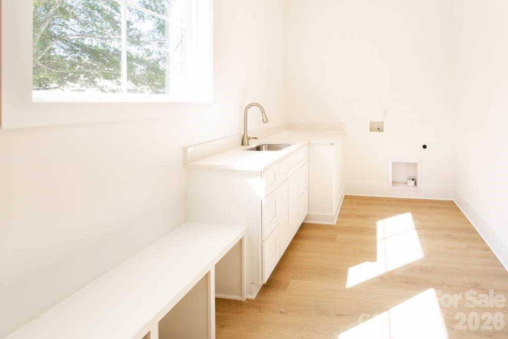 1 Antioch Church Road Weddington, NC 28104 - Photo 18 of 22 a hallway with a sink and a window