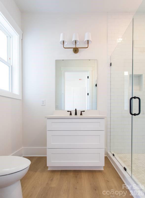 1 Antioch Church Road Weddington, NC 28104 - Photo 19 of 22 a bathroom with a sink mirror and a toilet