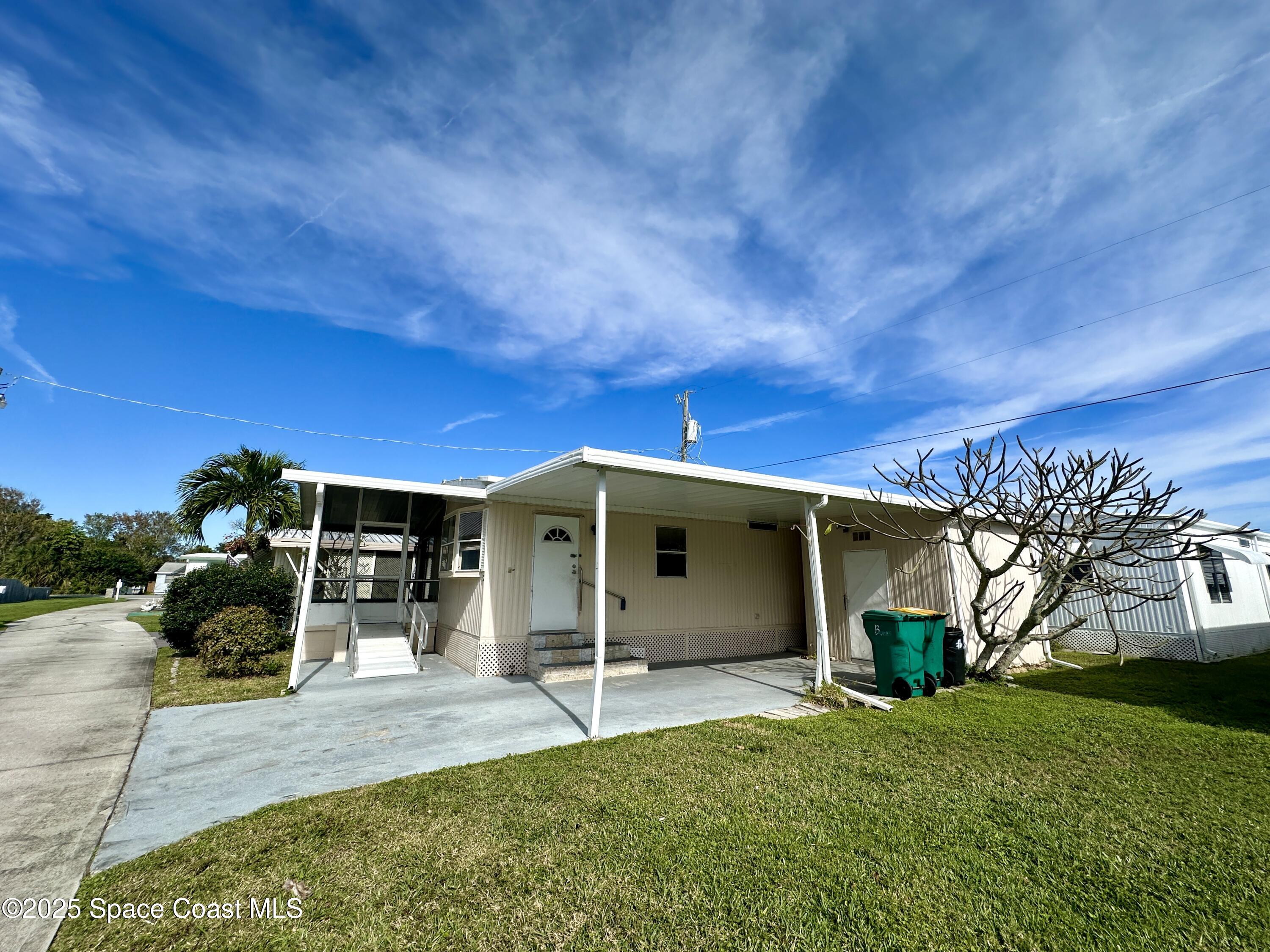 1675 Oceana Drive, Unit 5 Merritt Island, FL 32952 - Photo 13 of 14 Side of home