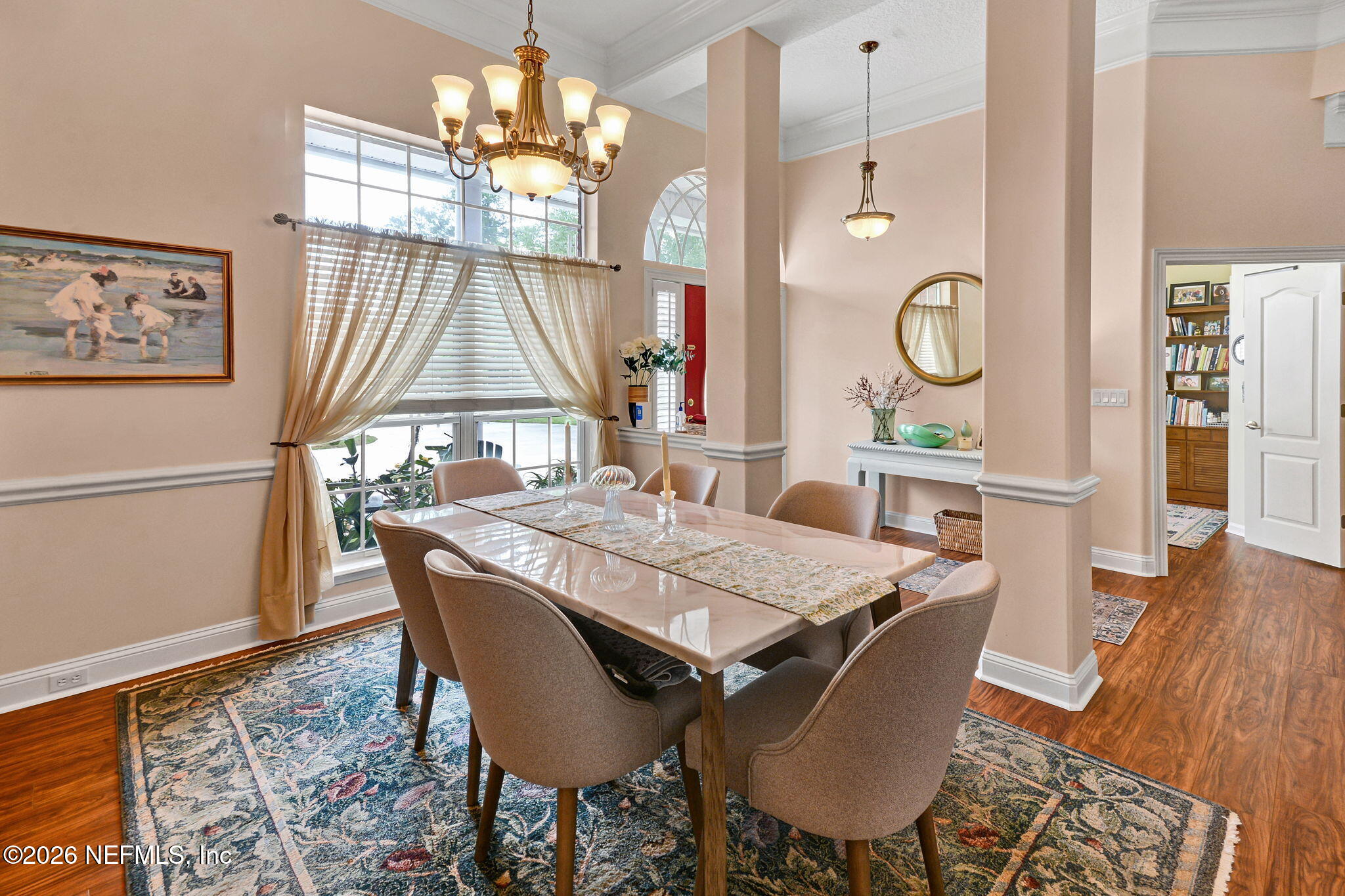 5950 West Shores Road Orange Park, FL 32003 - Photo 10 of 42 a view of a dining room with furniture and chandelier