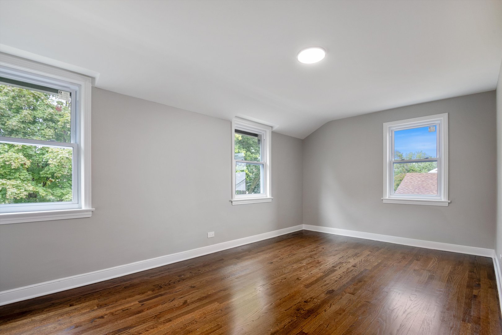 2513 5th Avenue North Riverside, IL 60546 - Photo 13 of 27 a view of an empty room with wooden floor and a window