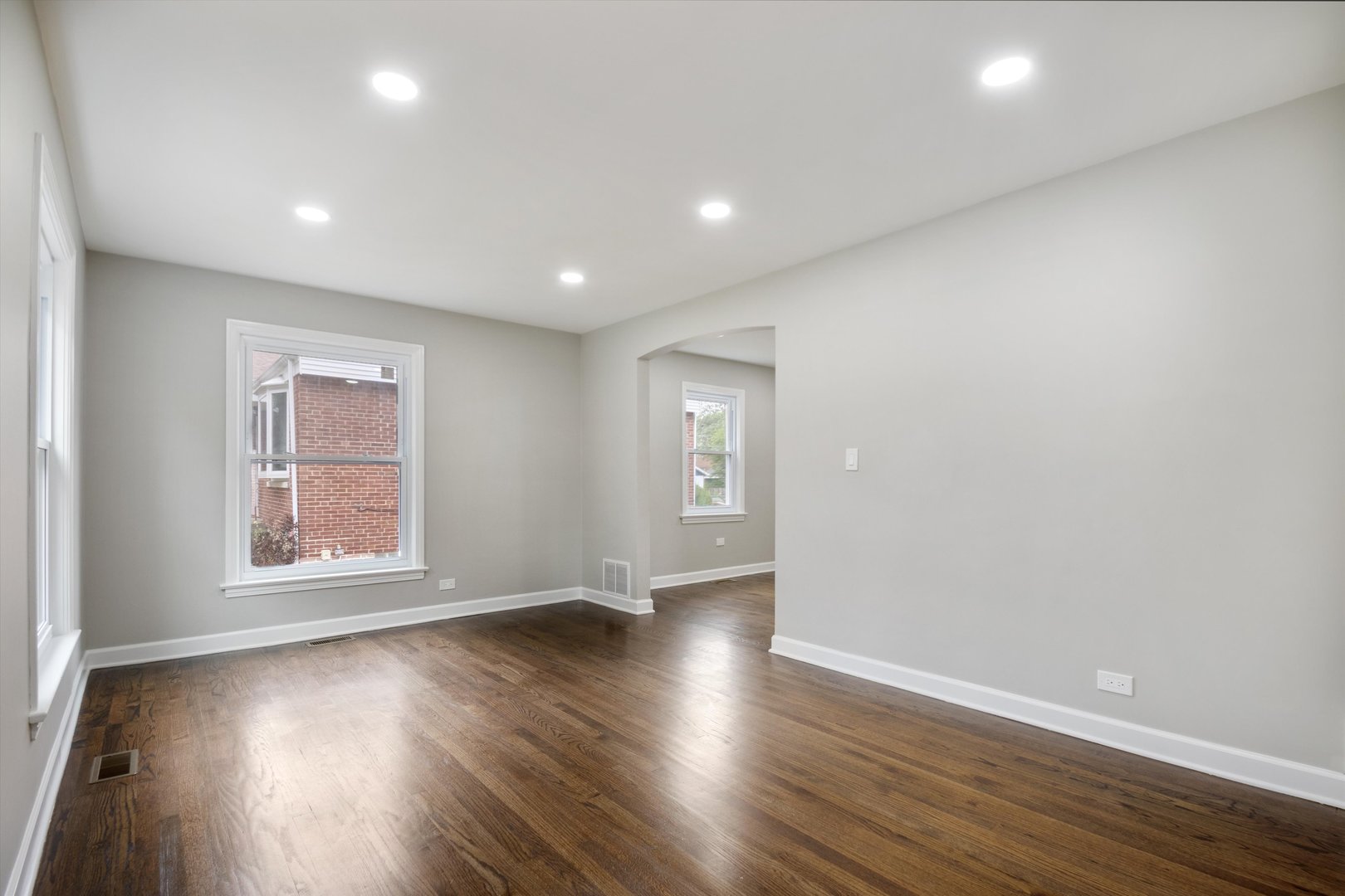 2513 5th Avenue North Riverside, IL 60546 - Photo 2 of 27 a view of an empty room with wooden floor and a window