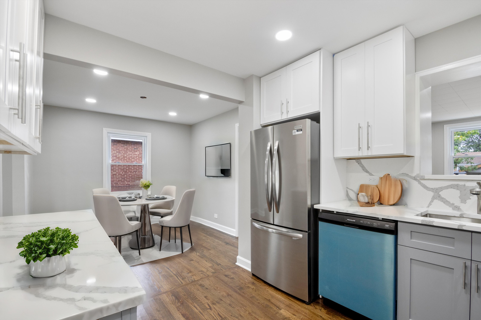 2513 5th Avenue North Riverside, IL 60546 - Photo 10 of 27 a kitchen with stainless steel appliances granite countertop a refrigerator sink and wooden floor