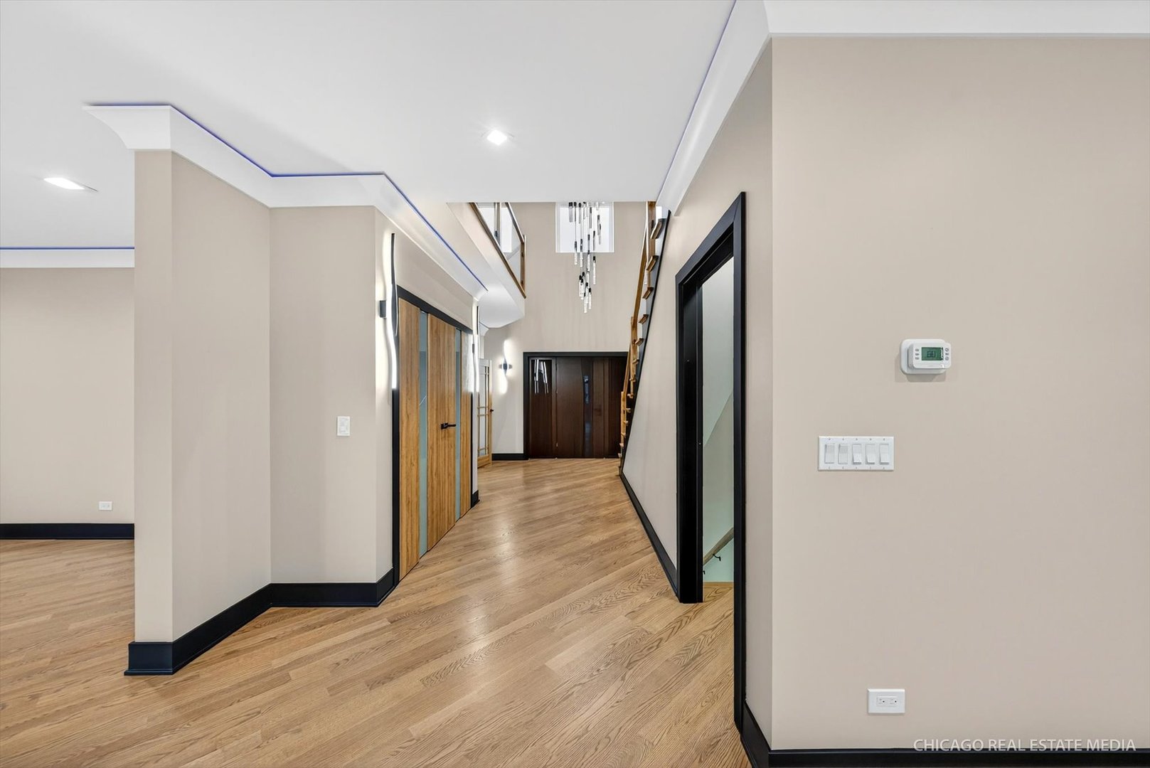 6090 Belmont Road Downers Grove, IL 60516 - Photo 13 of 75 a view of hallway with stairs and wooden floor