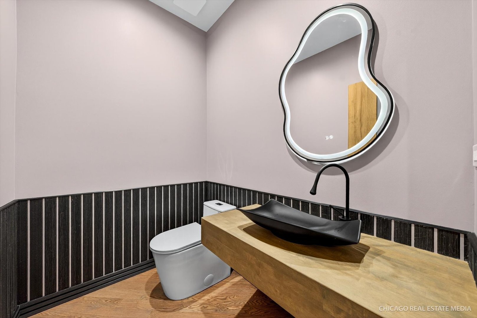 6090 Belmont Road Downers Grove, IL 60516 - Photo 27 of 75 a bathroom with a sink and a mirror