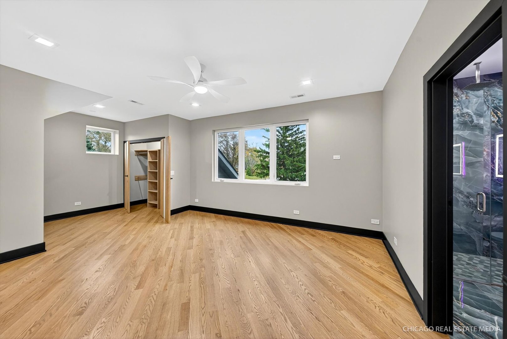 6090 Belmont Road Downers Grove, IL 60516 - Photo 46 of 75 an empty room with wooden floor and windows