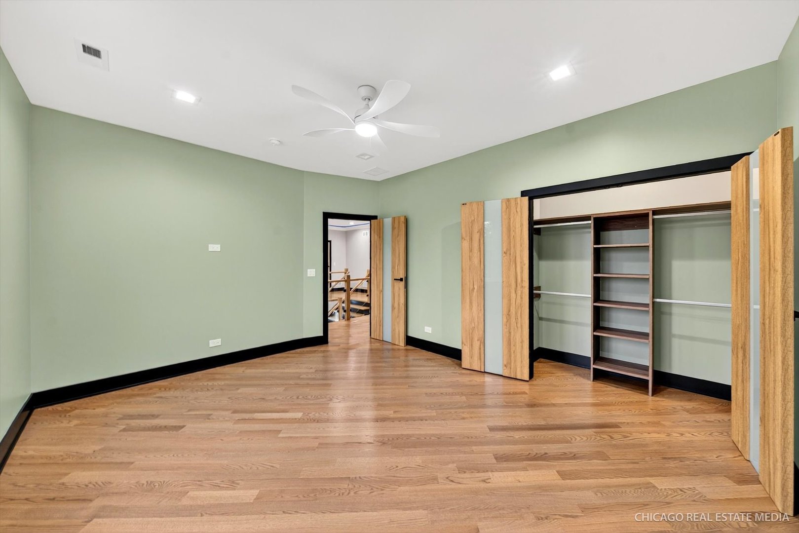 6090 Belmont Road Downers Grove, IL 60516 - Photo 53 of 75 an empty room with wooden floor closet and windows