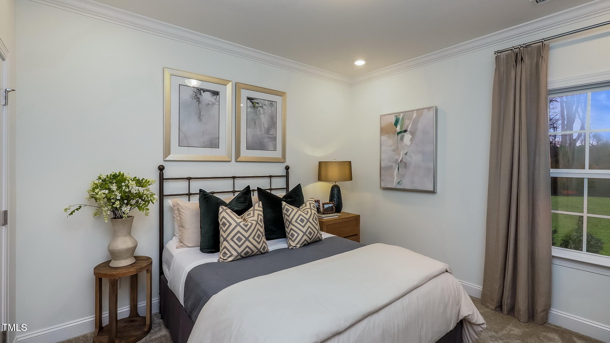 1307 Cosmic Drive Durham, NC 27703 - Photo 25 of 30 a bedroom with a bed and a potted plant