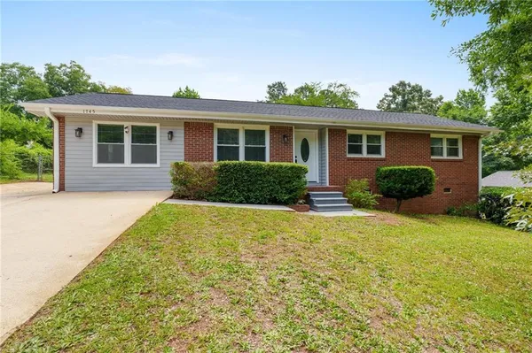 front view of a house that has a yard