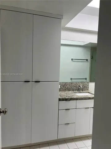 a bathroom with a sink and vanity
