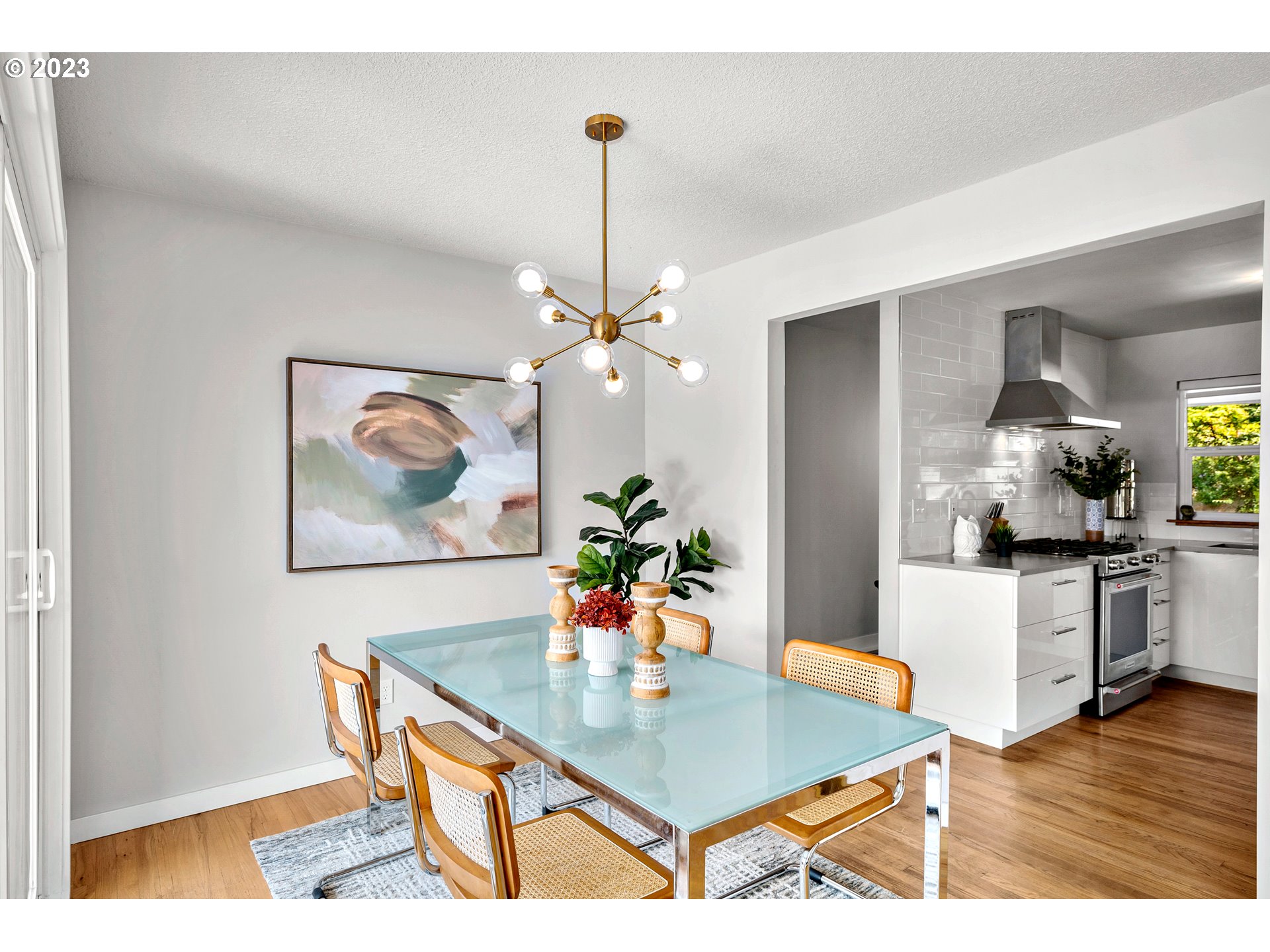 5914 Southwest Gunther Lane Portland, OR 97219 - Photo 14 of 40 a view of a dining room with furniture and wooden floor