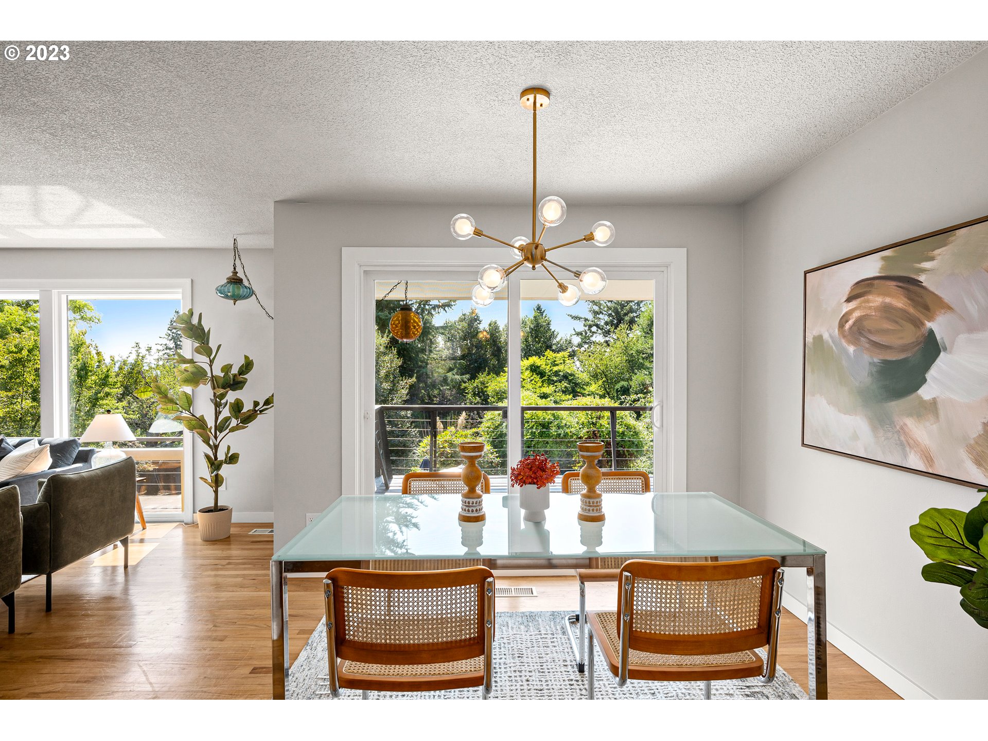 5914 Southwest Gunther Lane Portland, OR 97219 - Photo 15 of 40 a dining room with furniture and chandelier