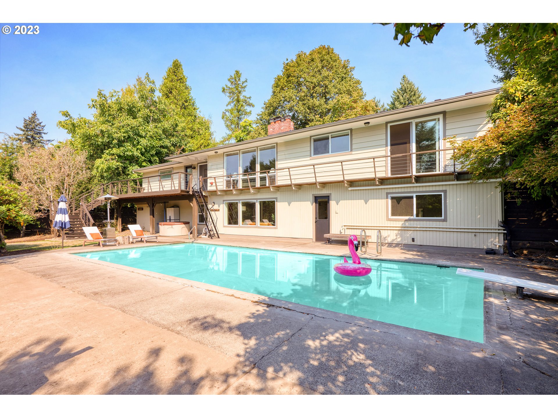 5914 Southwest Gunther Lane Portland, OR 97219 - Photo 2 of 40 a front view of a house with a yard