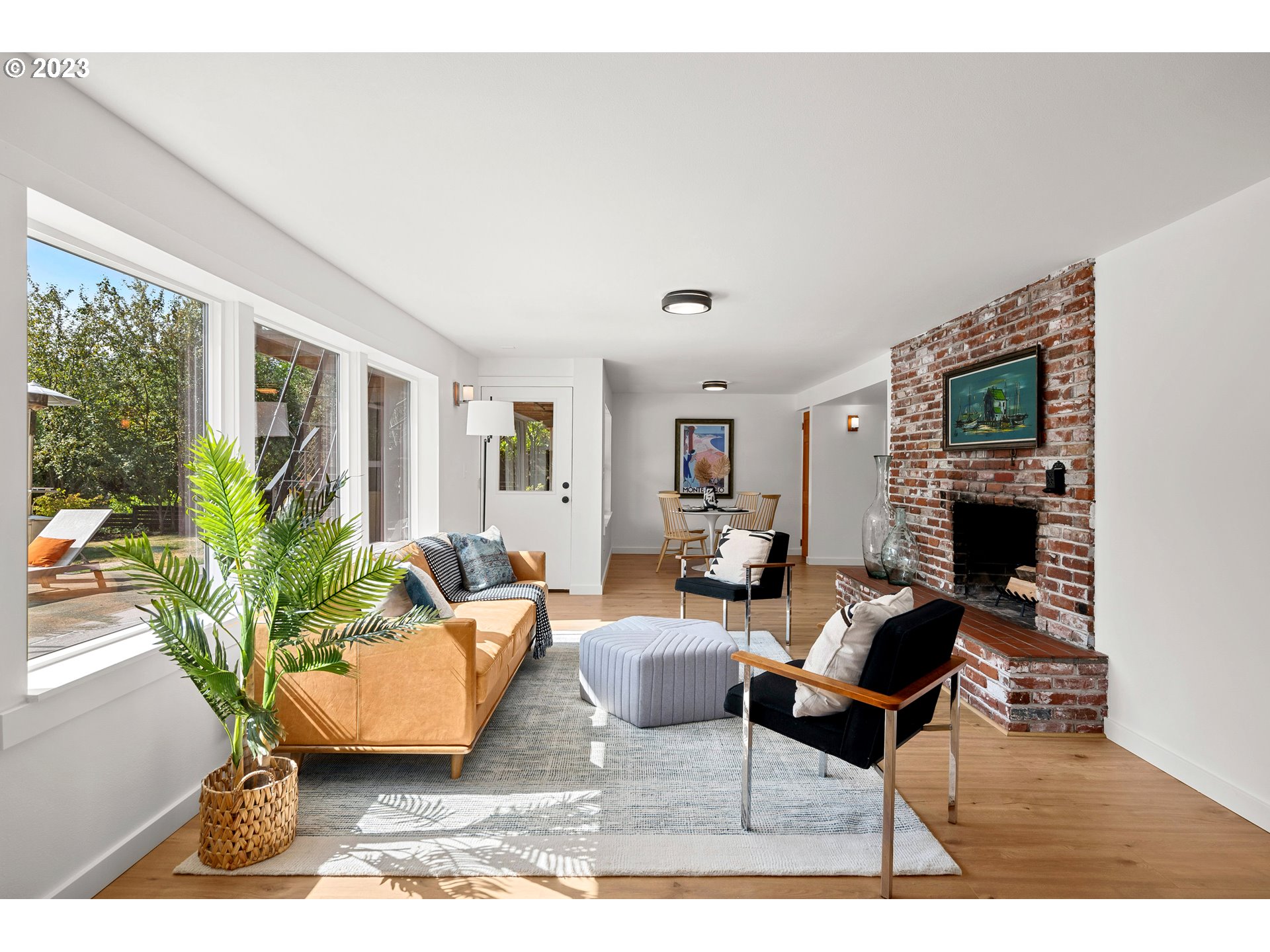 5914 Southwest Gunther Lane Portland, OR 97219 - Photo 23 of 40 a living room with furniture and a potted plant