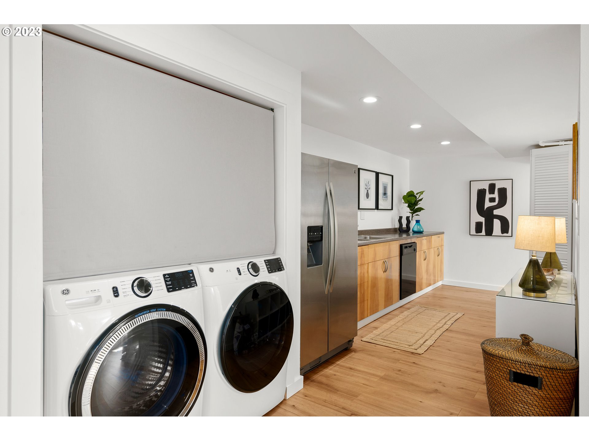 5914 Southwest Gunther Lane Portland, OR 97219 - Photo 26 of 40 a view of kitchen with washer and dryer