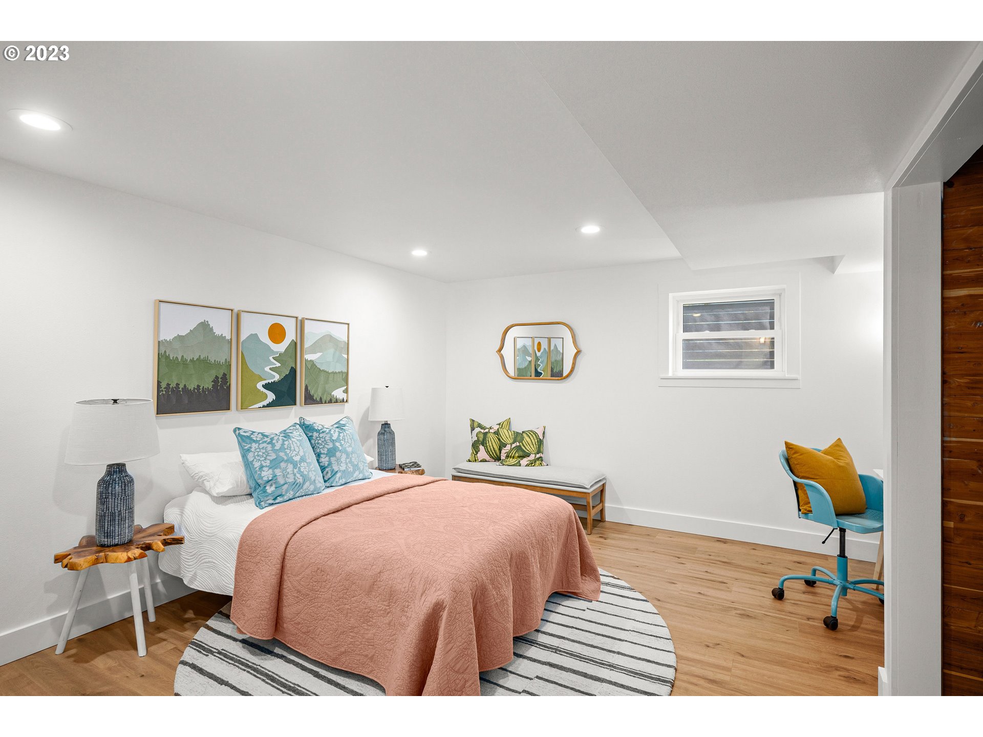 5914 Southwest Gunther Lane Portland, OR 97219 - Photo 31 of 40 a bedroom with a bed and wooden floor