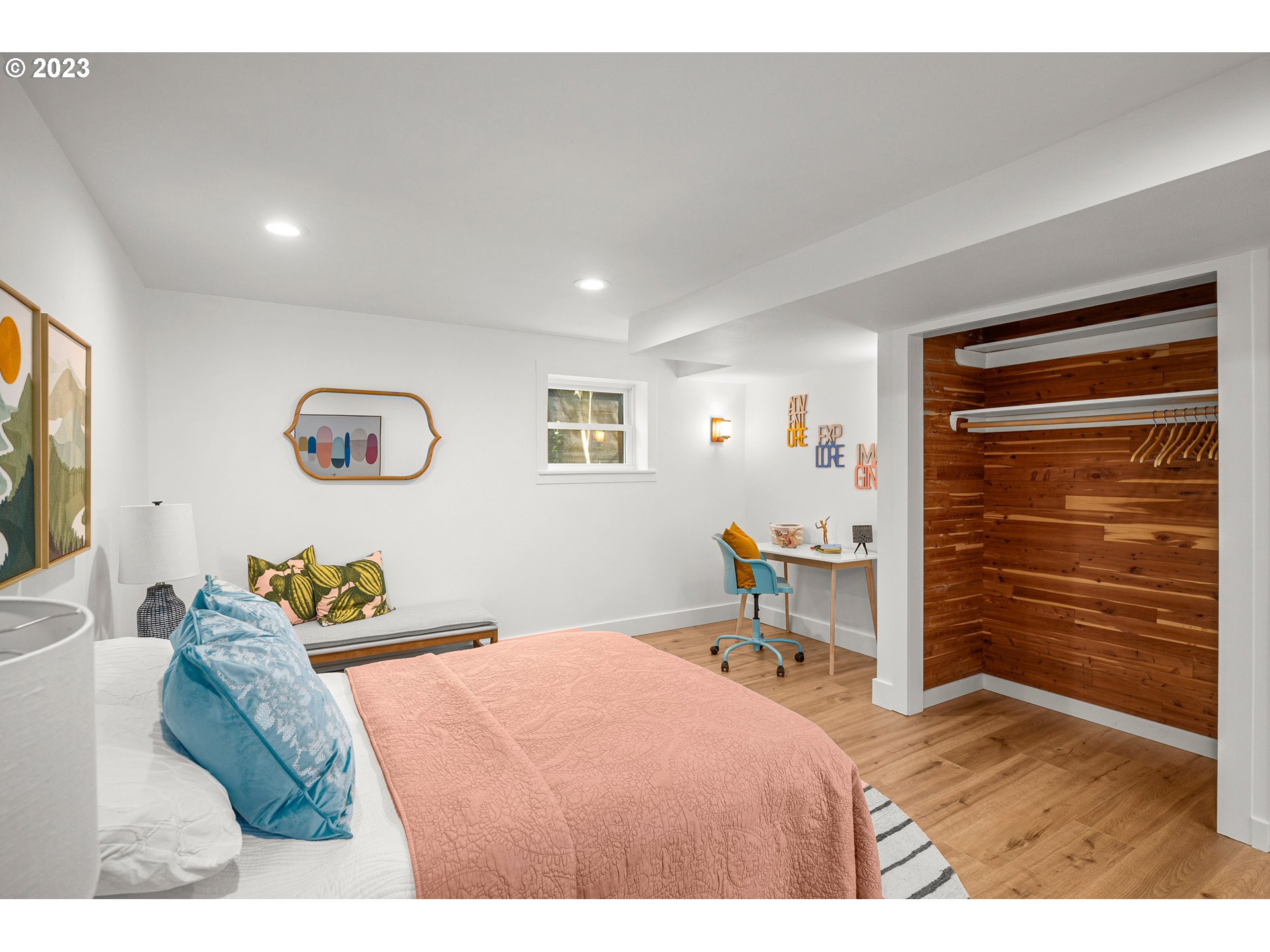 5914 Southwest Gunther Lane Portland, OR 97219 - Photo 32 of 40 a bedroom with a bed and a dresser in it