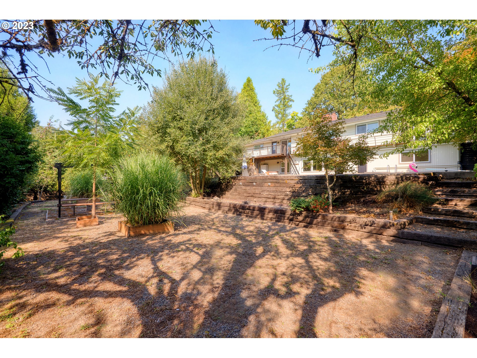 5914 Southwest Gunther Lane Portland, OR 97219 - Photo 36 of 40 a view of a backyard of a house