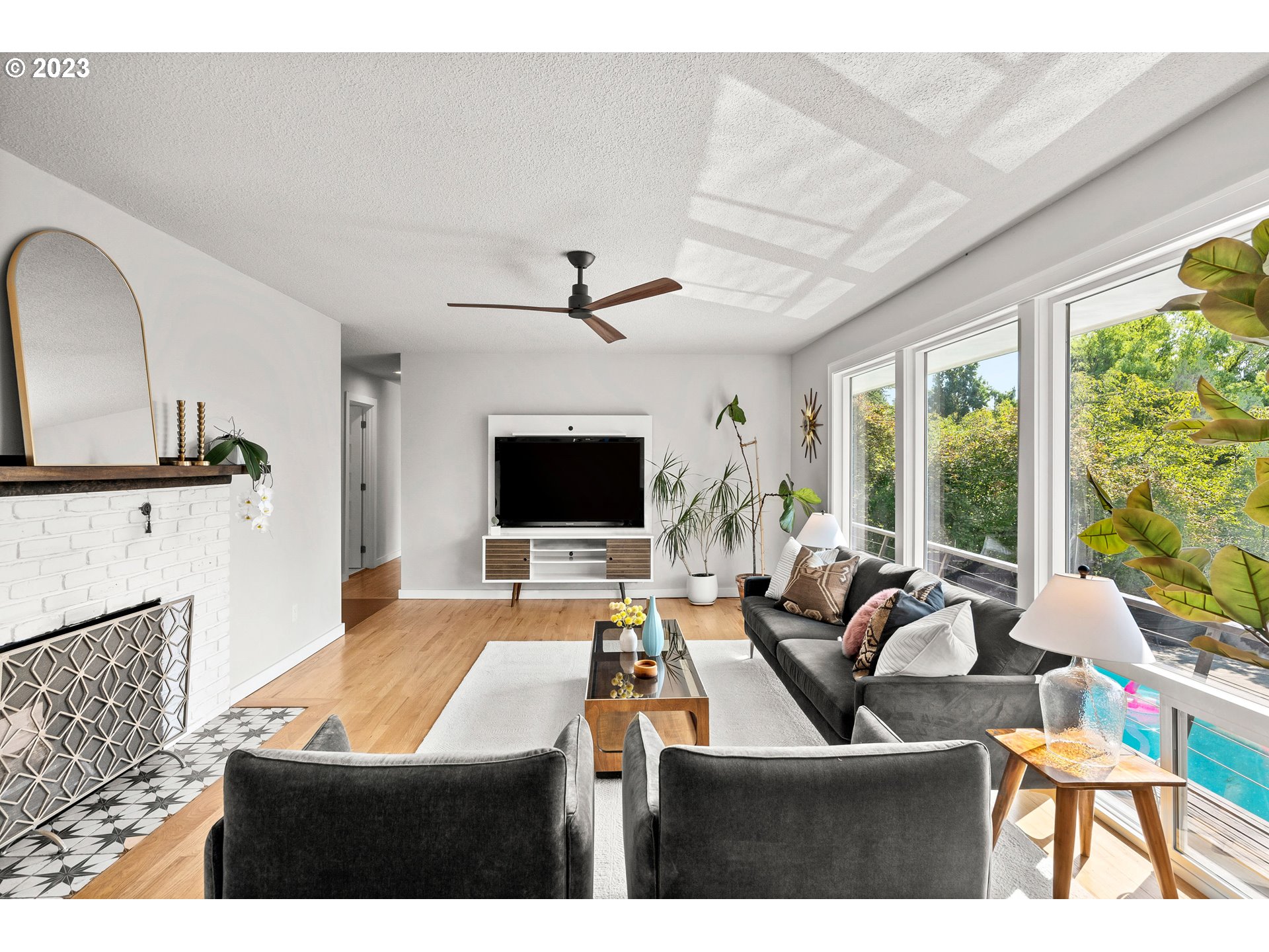 5914 Southwest Gunther Lane Portland, OR 97219 - Photo 6 of 40 a room with furniture pool table flat screen tv and windows