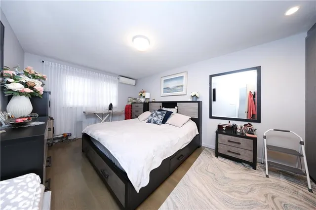 a bed room with a bed and a tv