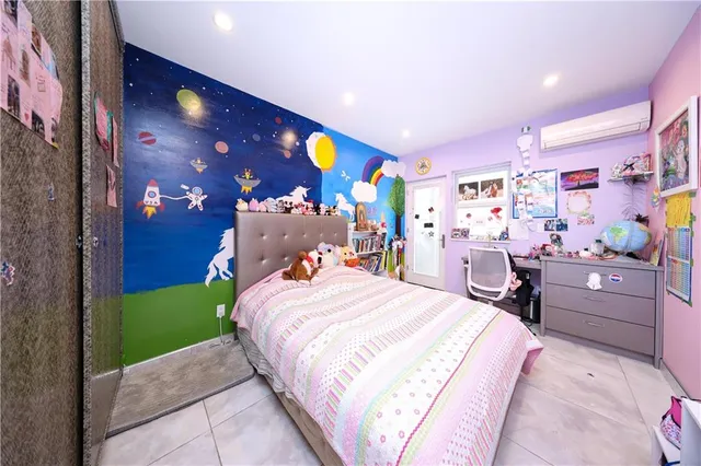 a bed room with a bed and a dresser