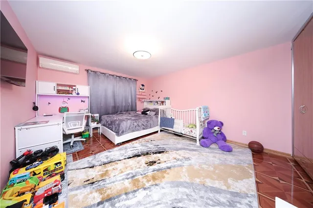 a bed room with a bed and a dresser