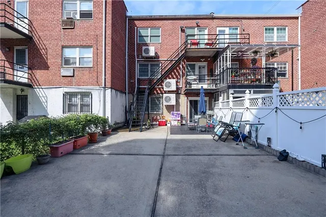 a view of a brick building with many windows