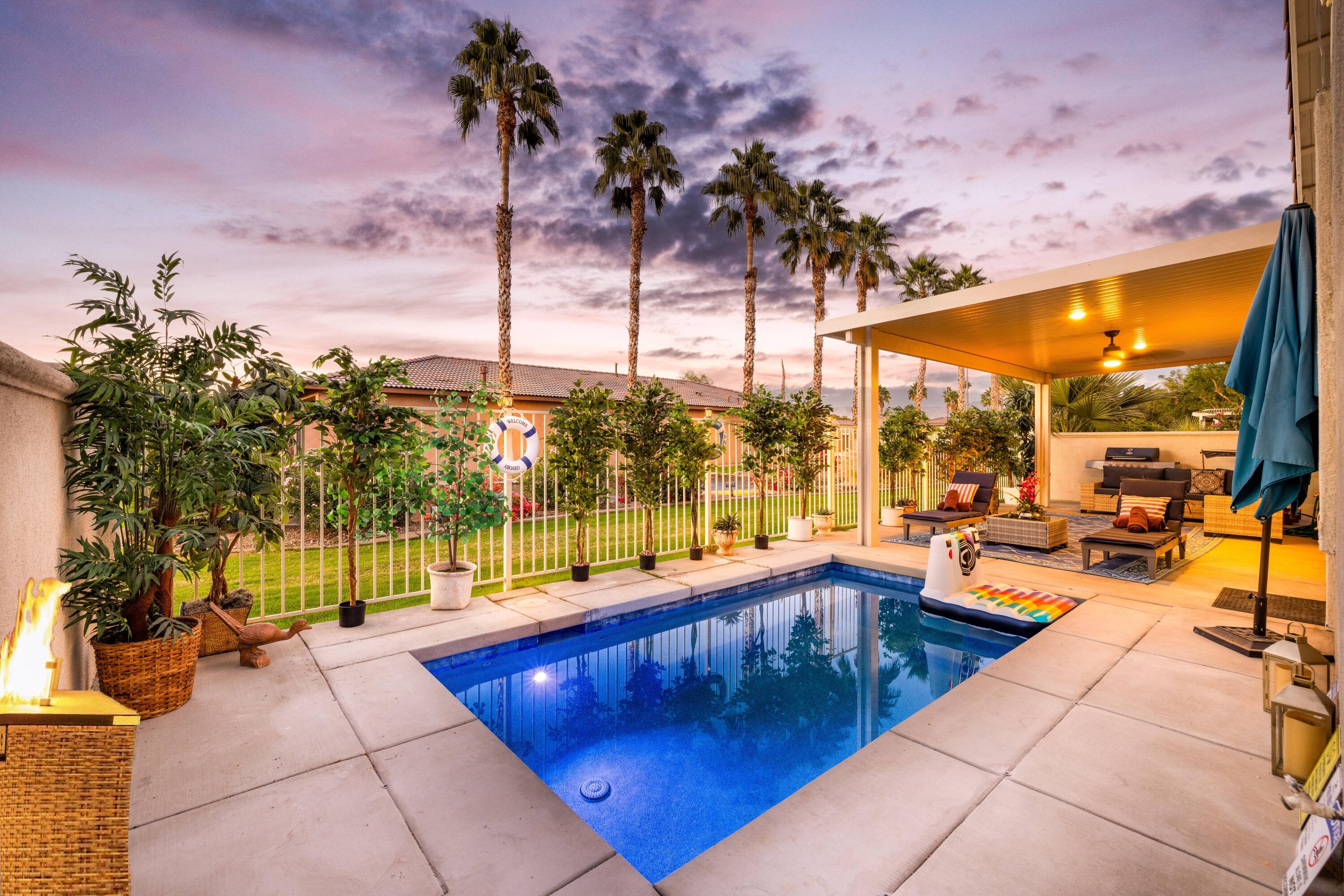 49527 Wayne Street Indio, CA 92201 - Photo 12 of 147 a view of swimming pool with a lounge chairs