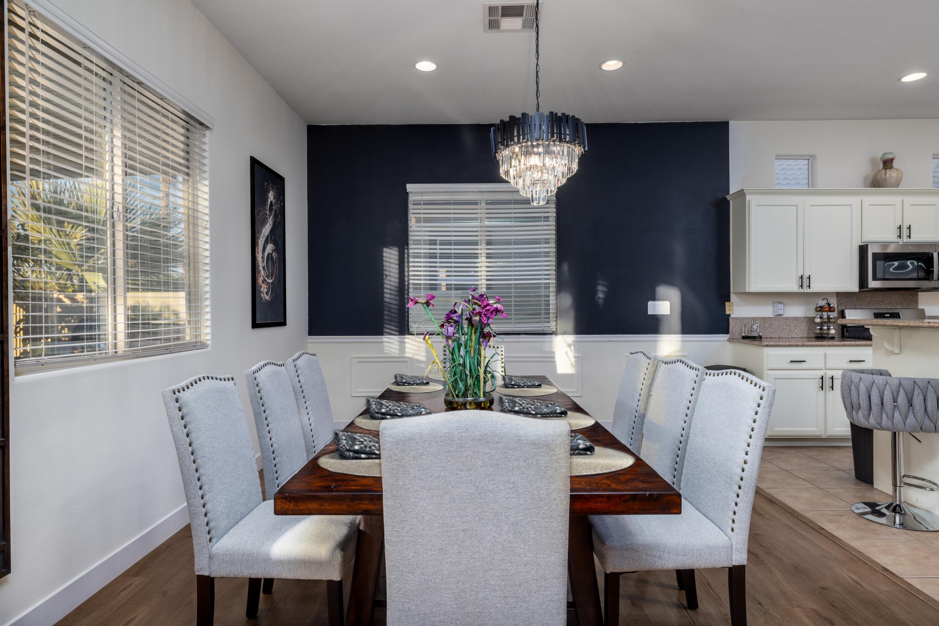 49527 Wayne Street Indio, CA 92201 - Photo 18 of 147 a view of a dining room with furniture wooden floor and chandelier