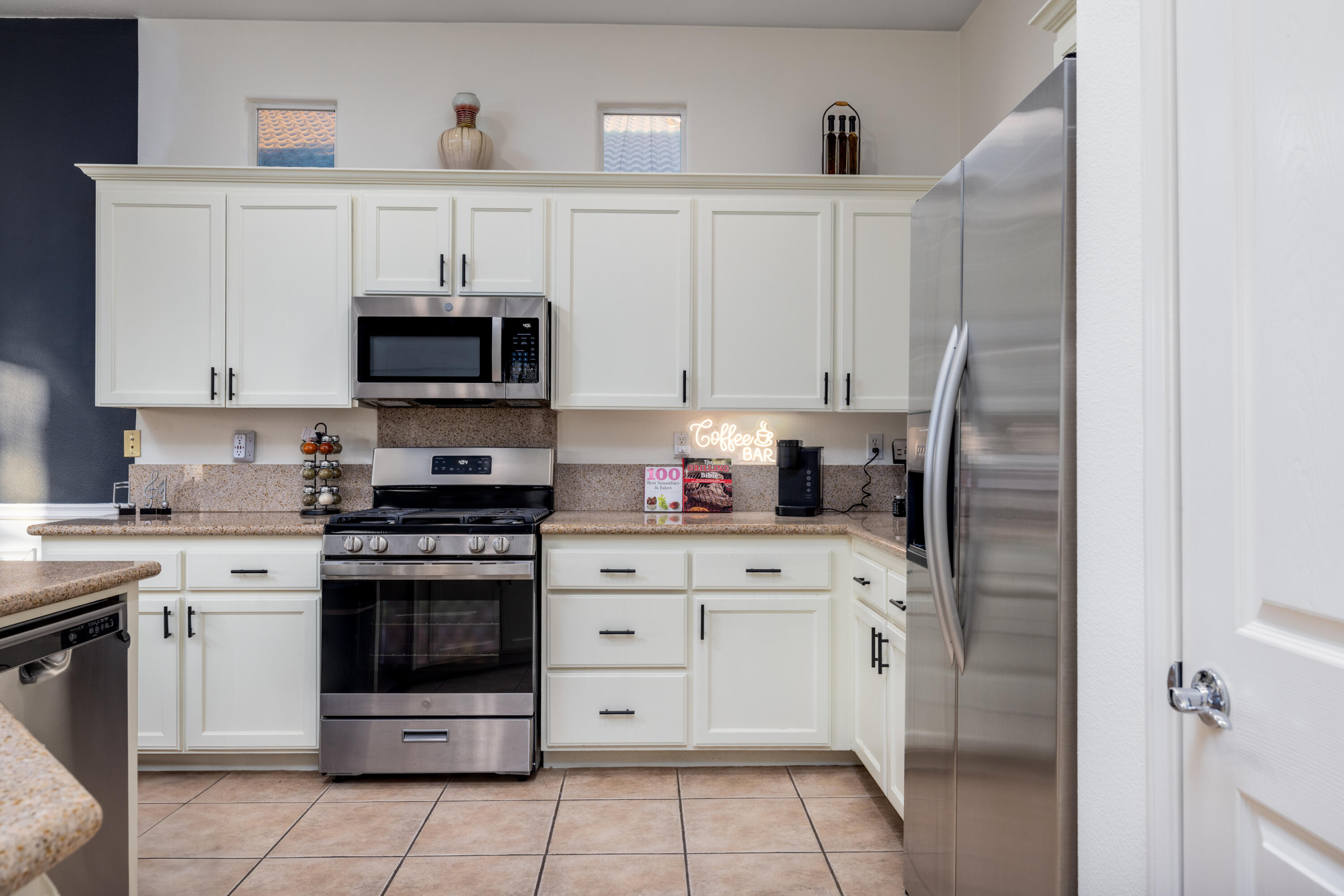 49527 Wayne Street Indio, CA 92201 - Photo 22 of 147 a kitchen with cabinets stainless steel appliances and a sink