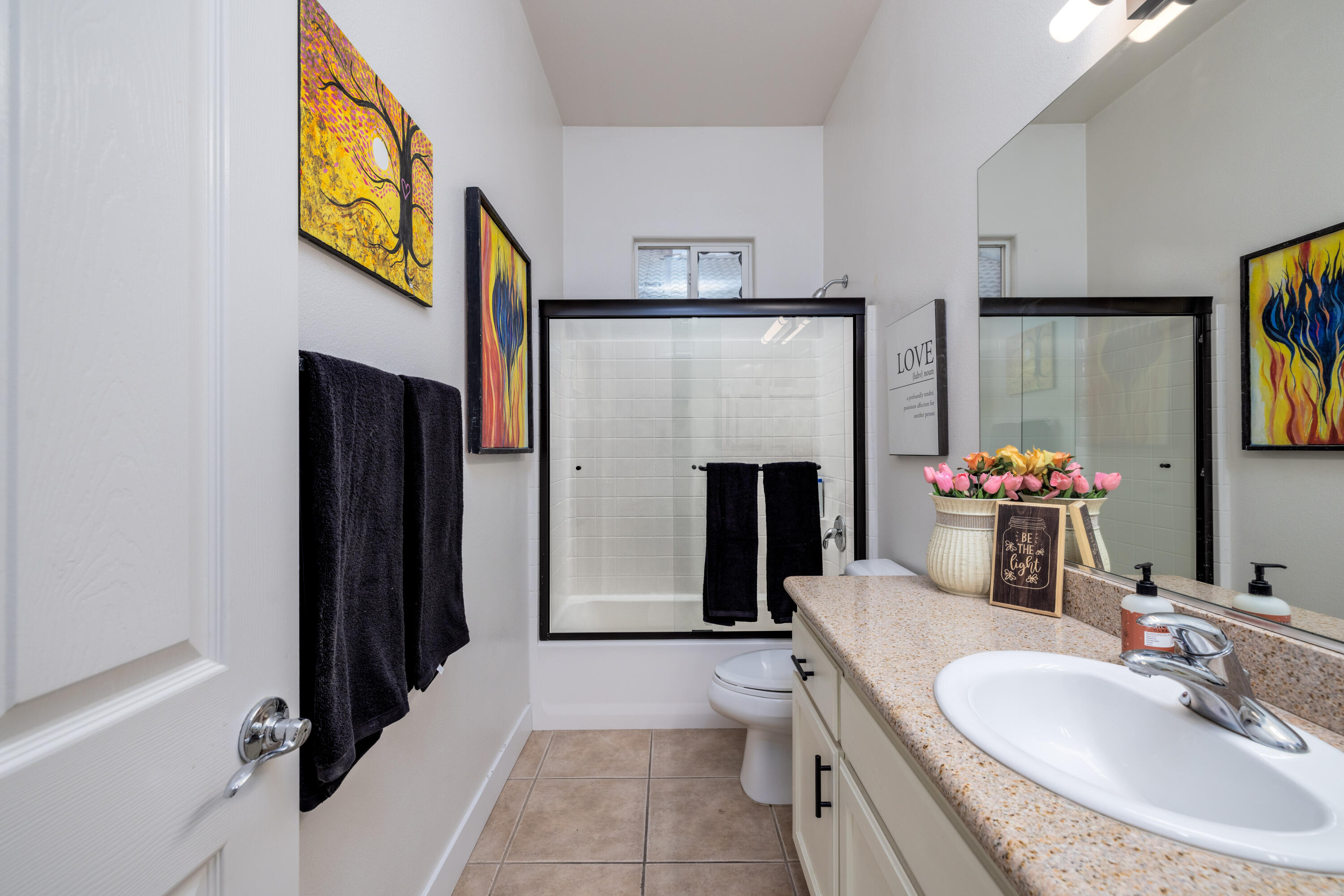49527 Wayne Street Indio, CA 92201 - Photo 34 of 147 a bathroom with a granite countertop sink and a mirror