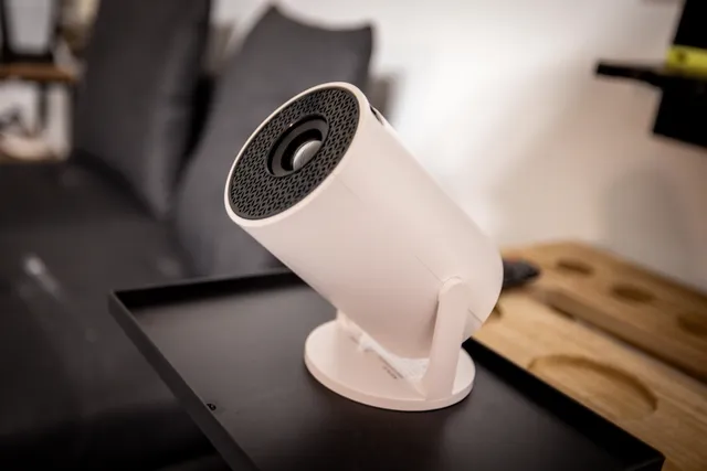 a view of a garden with a building in the background