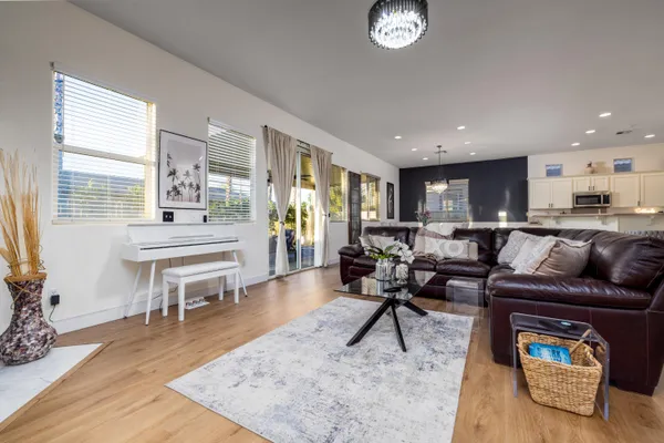a view of swimming pool with a lounge chairs