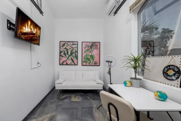 a view of a dining room with furniture wooden floor and chandelier