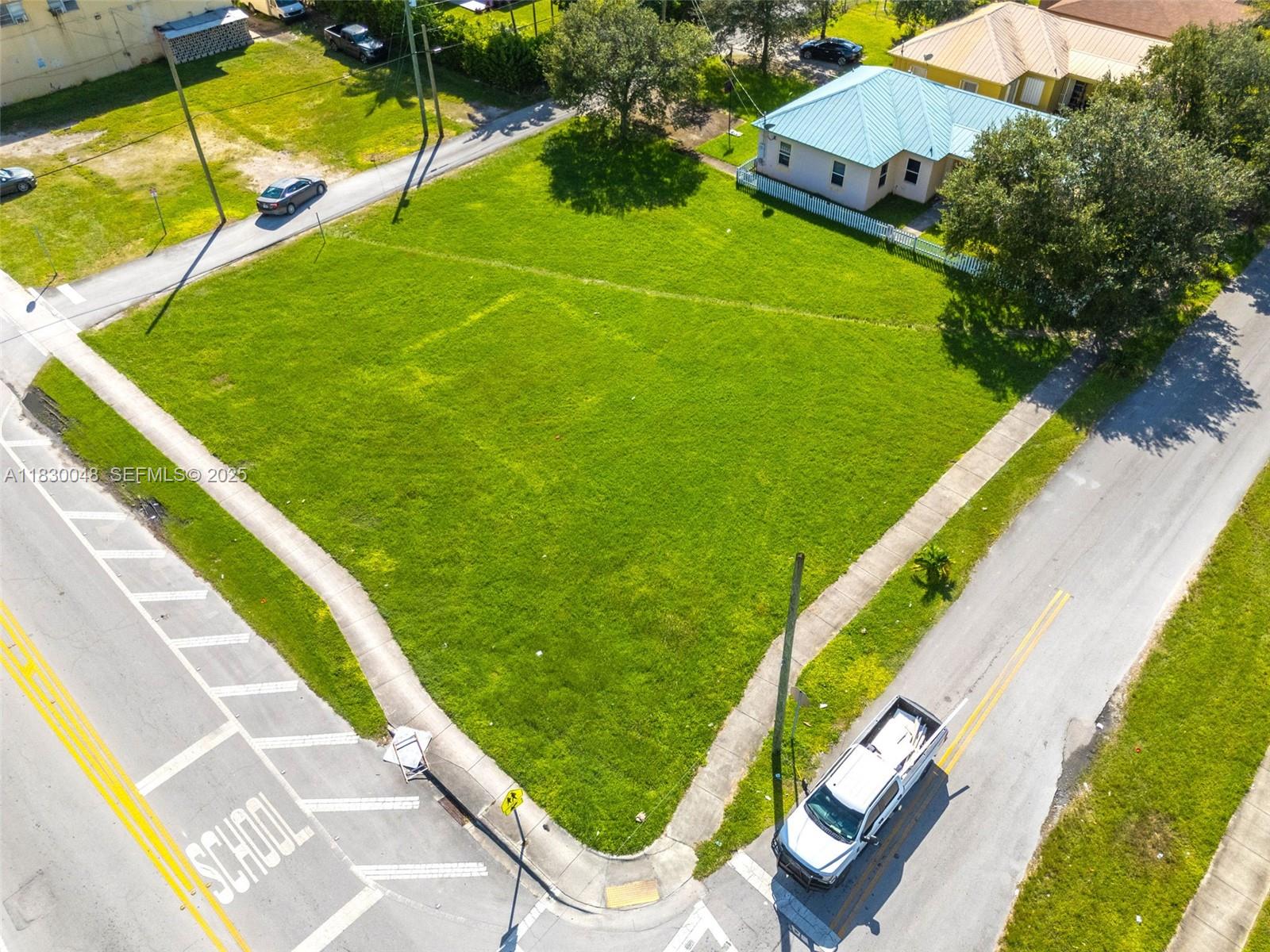 604 Southwest 6th Avenue Homestead, FL 33030 - Photo 16 of 18 a view of a swimming pool with a garden and plants