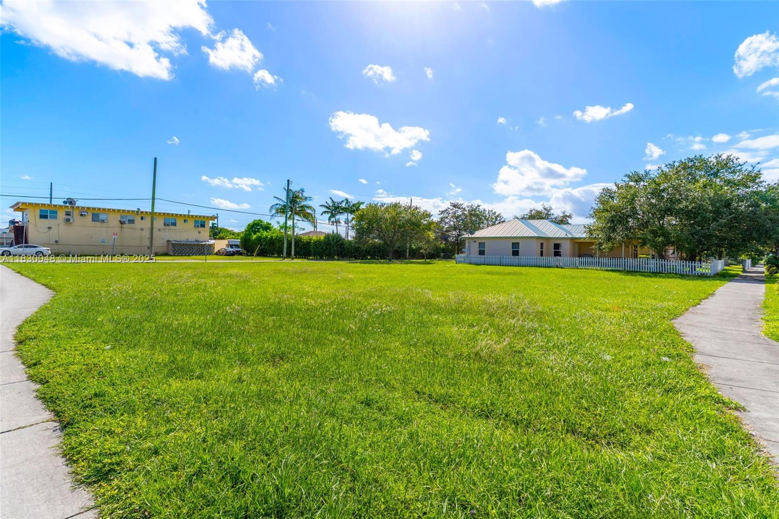 604 Southwest 6th Avenue Homestead, FL 33030 - Photo 17 of 18 a view of a fountain in front of a house with a big yard