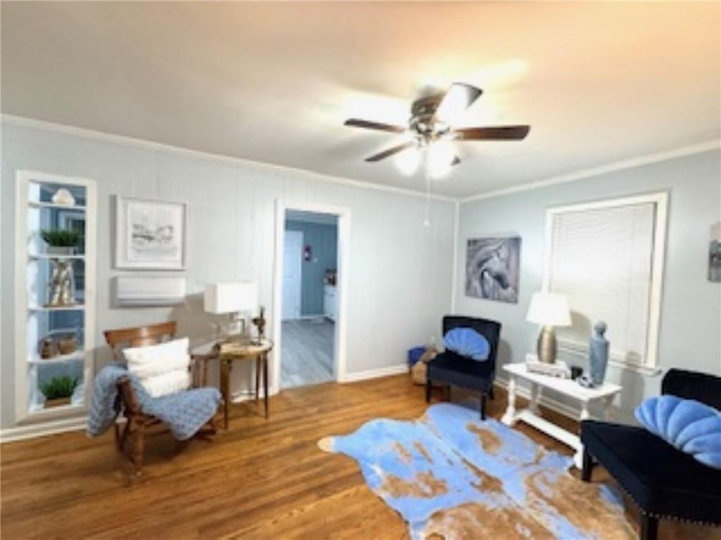 209 Moultrie Lane Southwest Rome, GA 30161 - Photo 20 of 46 a living room with furniture and a wooden floor
