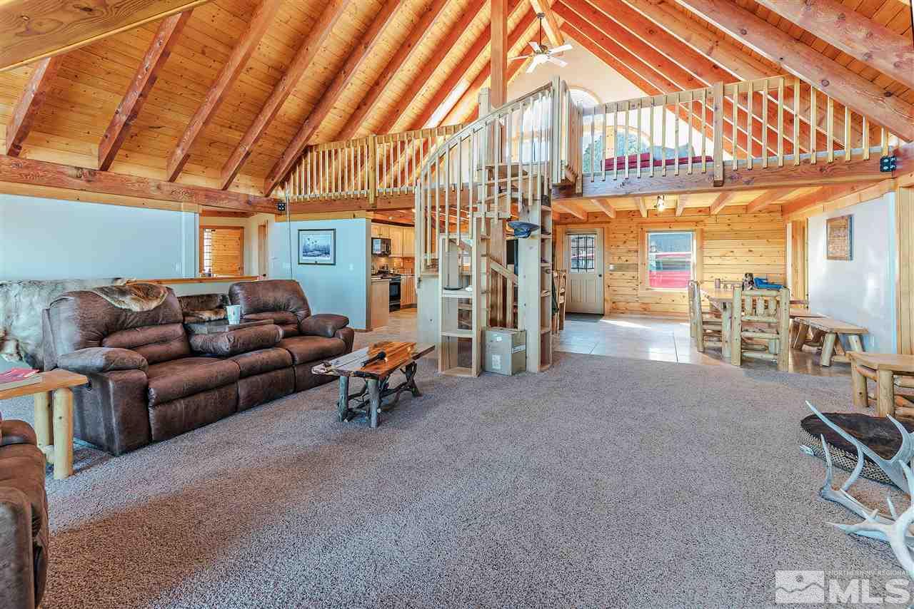 4820 Livery Road Reno, NV 89521 - Photo 11 of 25 a living room with furniture a ceiling fan and a rug