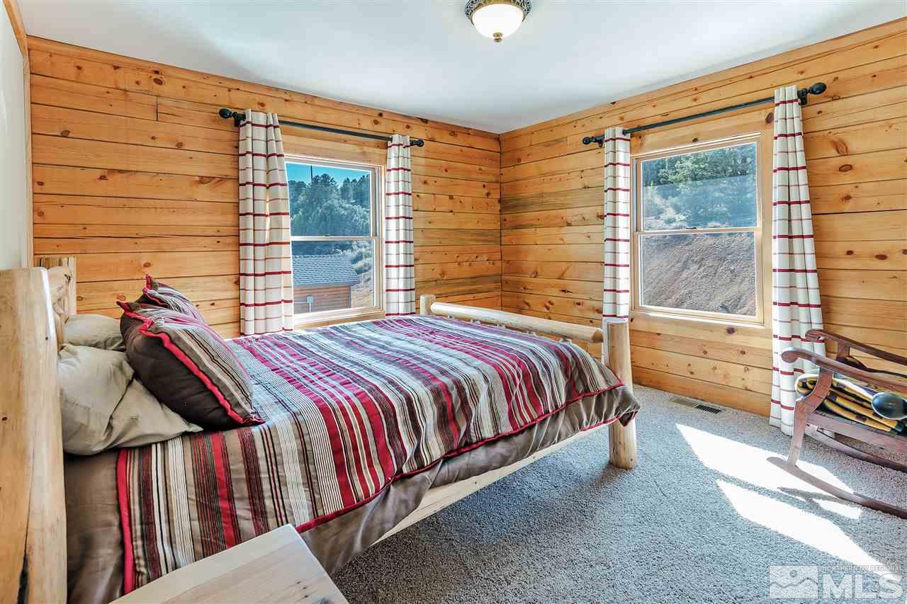 4820 Livery Road Reno, NV 89521 - Photo 13 of 25 a bedroom with a bed and walk in closet